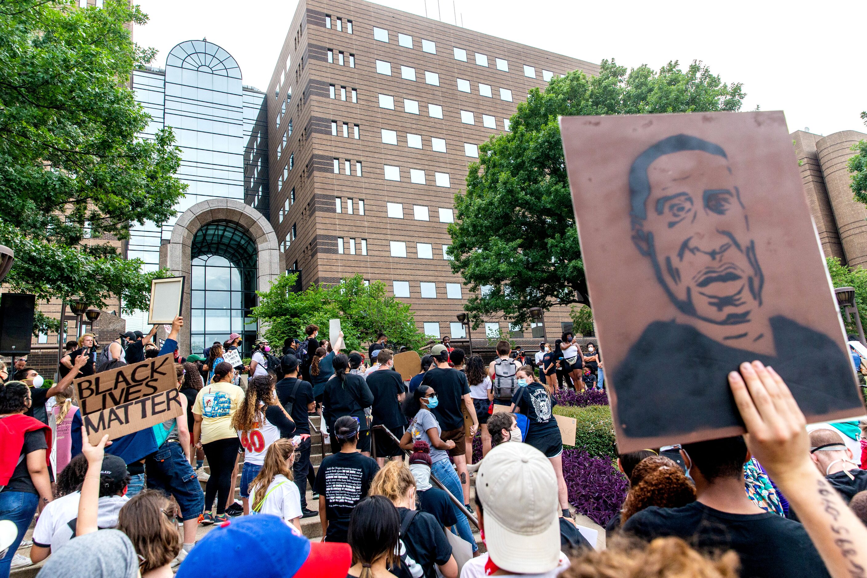 Protesters gather outside the Frank Crowley Courts building past the city’s 7 p.m. curfew...