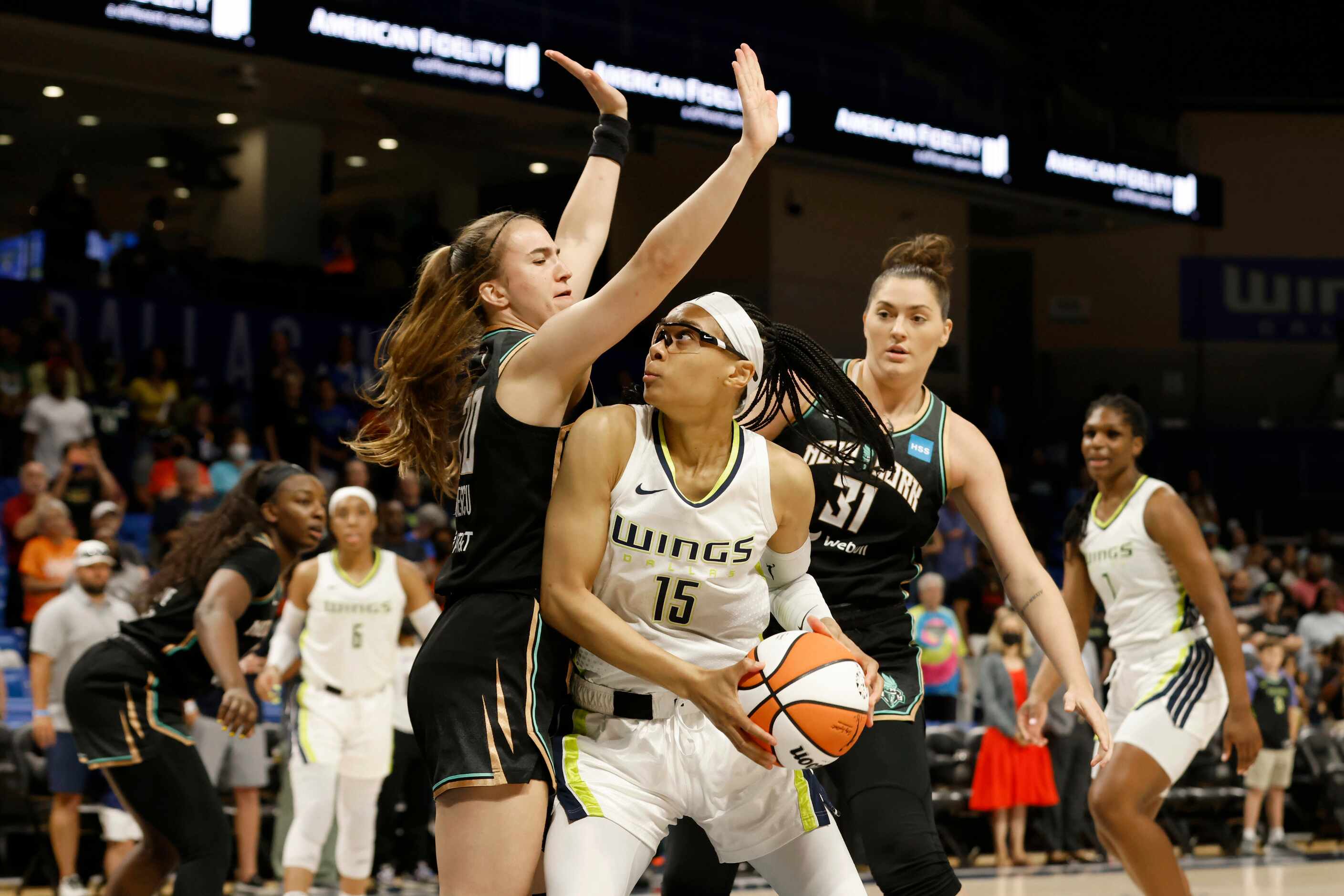 New York Liberty guard Sabrina Ionescu, front left, and center Stefanie Dolson (31) defend...