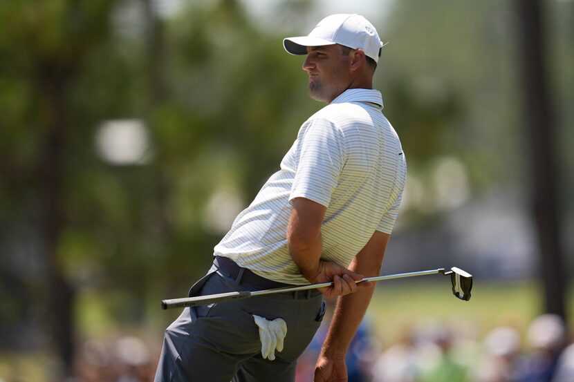 Scottie Scheffler reacts after missing a putt on the seventh hole during the second round of...