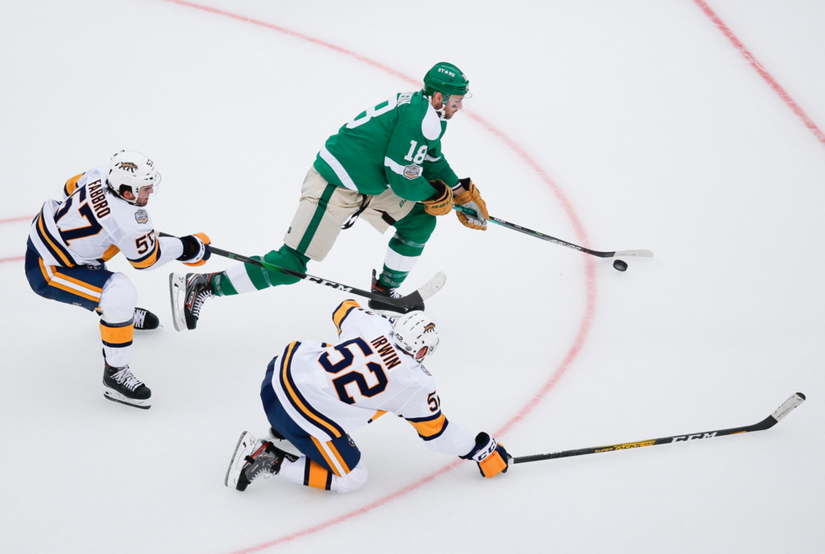 Dallas Stars center Jason Dickinson (18) makes a break past Nashville Predators defenseman...