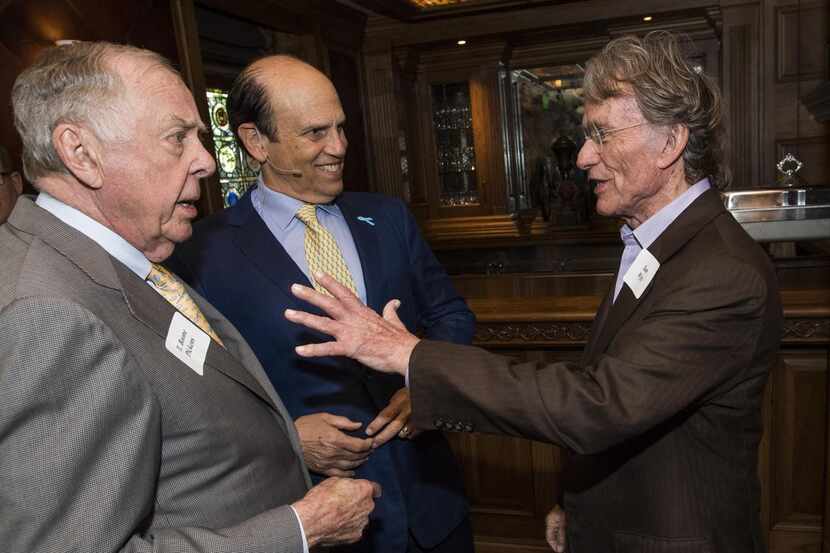 T. Boone Pickens  (left) and Mike Milken chatted with Sam Wyly at a June 3 luncheon. Milken...