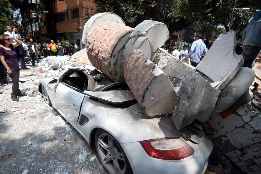 Picture of a car crashed by debris from a damaged building after a quake rattled Mexico City...