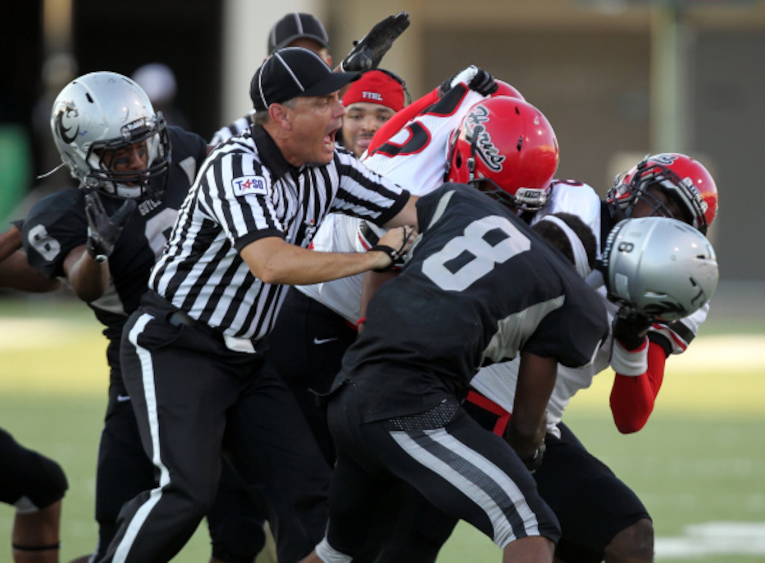 DeSoto head coach Claude Mathis in the third quarter during a high school football game,...