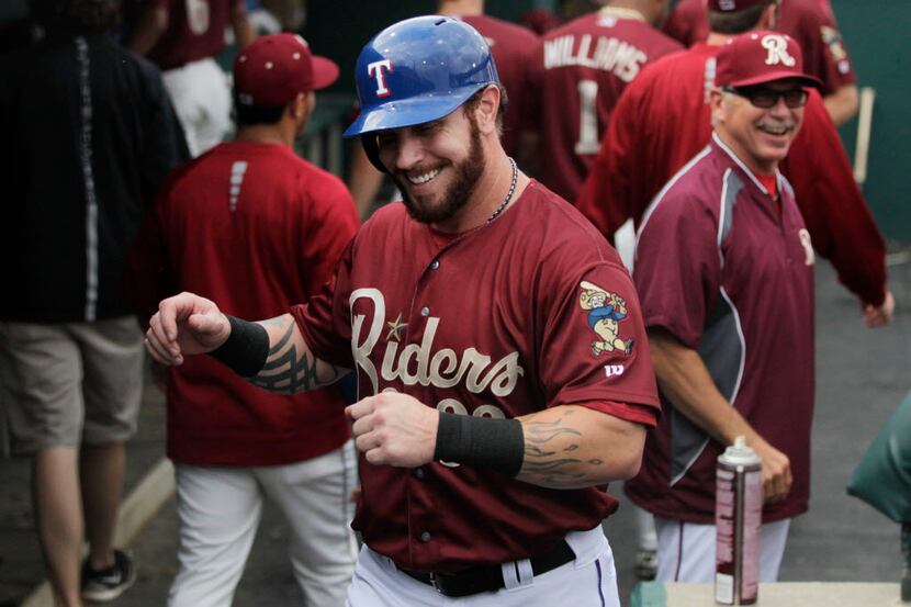 Frisco RoughRiders Josh Hamilton walks to return his helmet after getting congratulations...