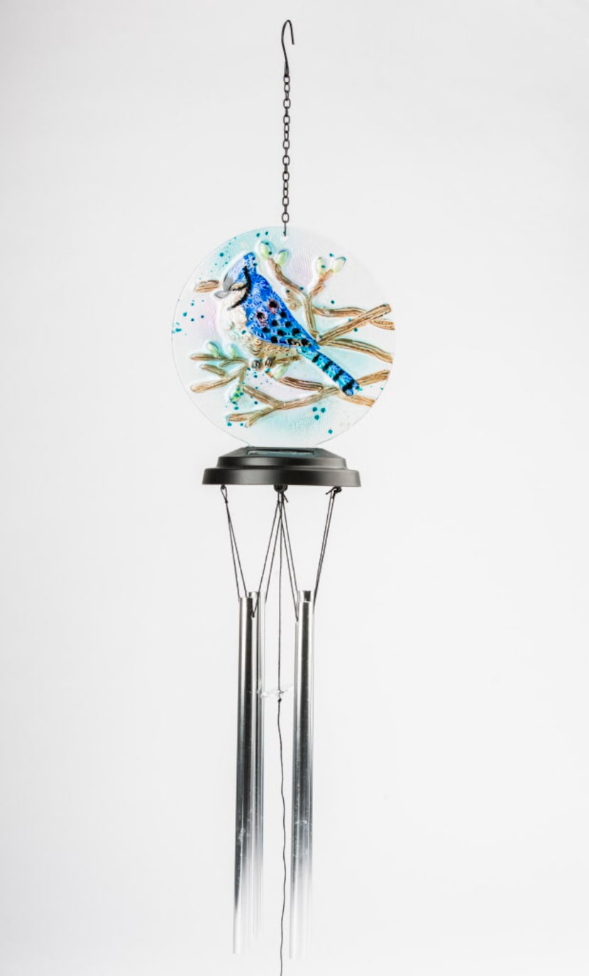 A blue jay adorns solar wind chimes that glow at night. $26.99 at the Dallas Arboretum’s...