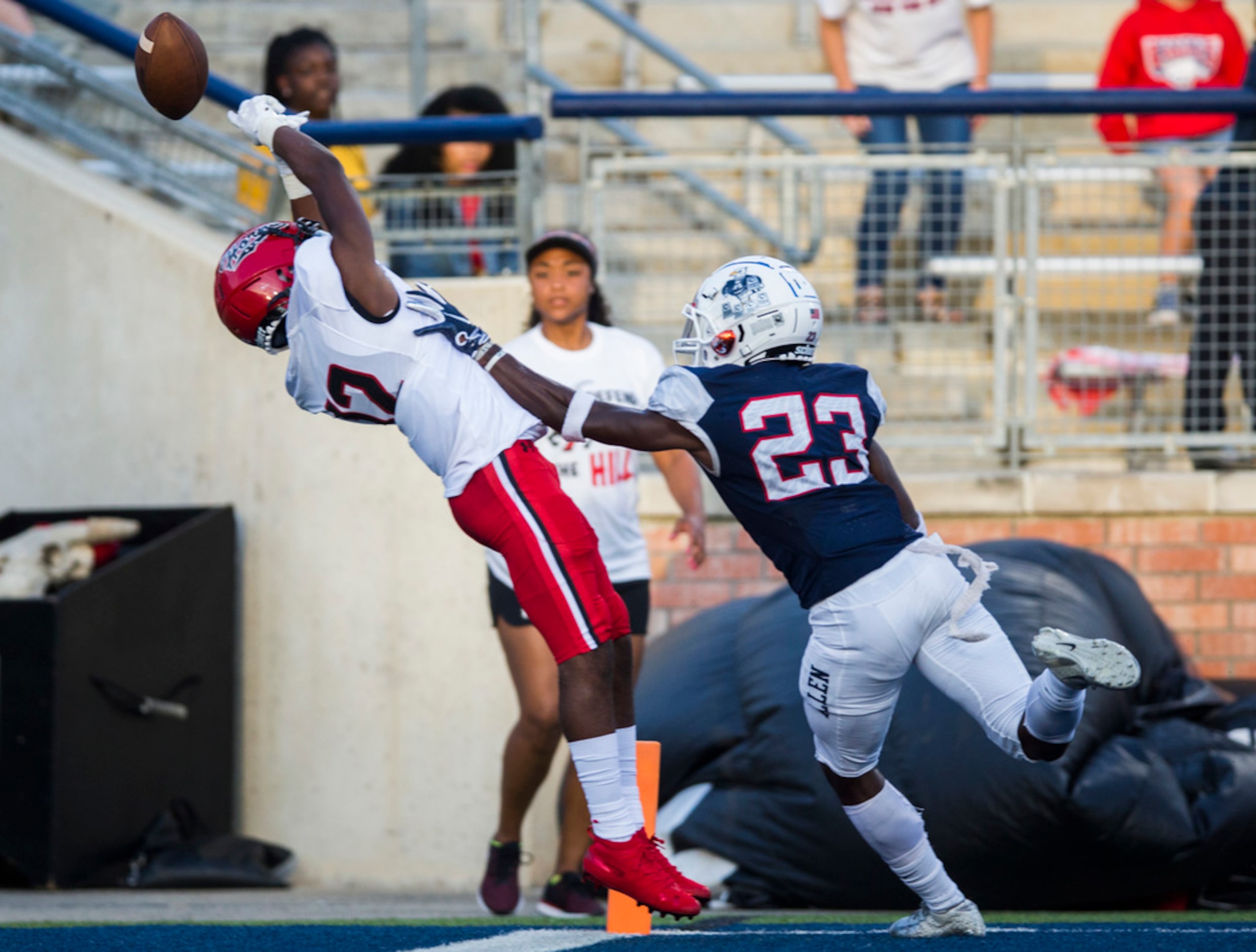 Allen defensive back Zayteak McGhee (23) breaks up a pass to Cedar Hill wide receiver Brian...