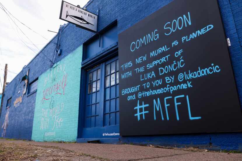 A sign teases a new mural on Tuesday, Jan. 17, 2023, in the spot where Dallas Mavericks Luka...