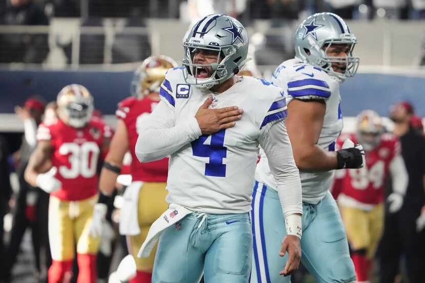 Dallas Cowboys quarterback Dak Prescott (4) celebrates after throwing a touchdown  pass to...