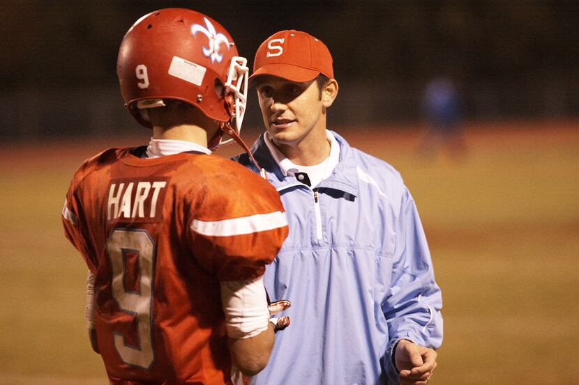 First Baptist head football coach Jason Lovvorn gives advice to Trae Hart, a junior who had...