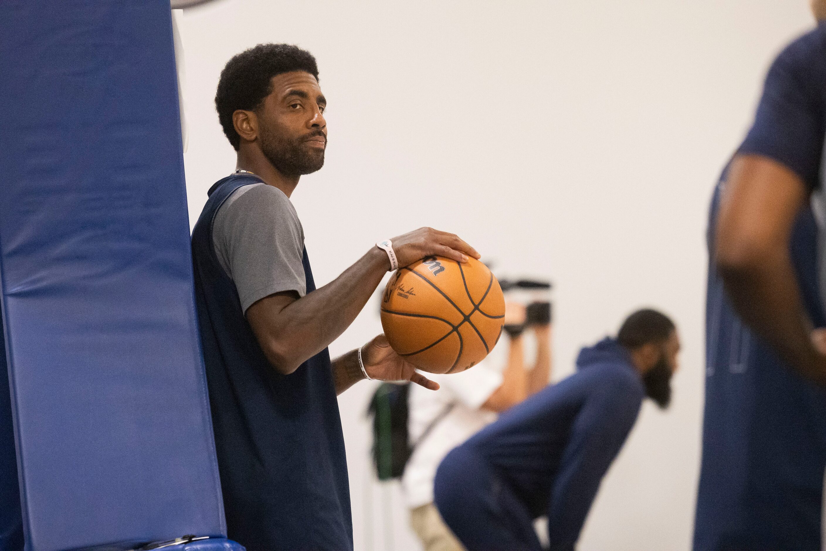 Dallas Mavericks guard Kyrie Irving (11) watches as teammates practice at the Mavericks...