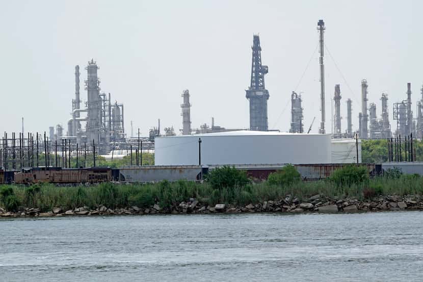 Storage tanks at a refinery along the waterway are shown Thursday, July 26, 2018, in Port...