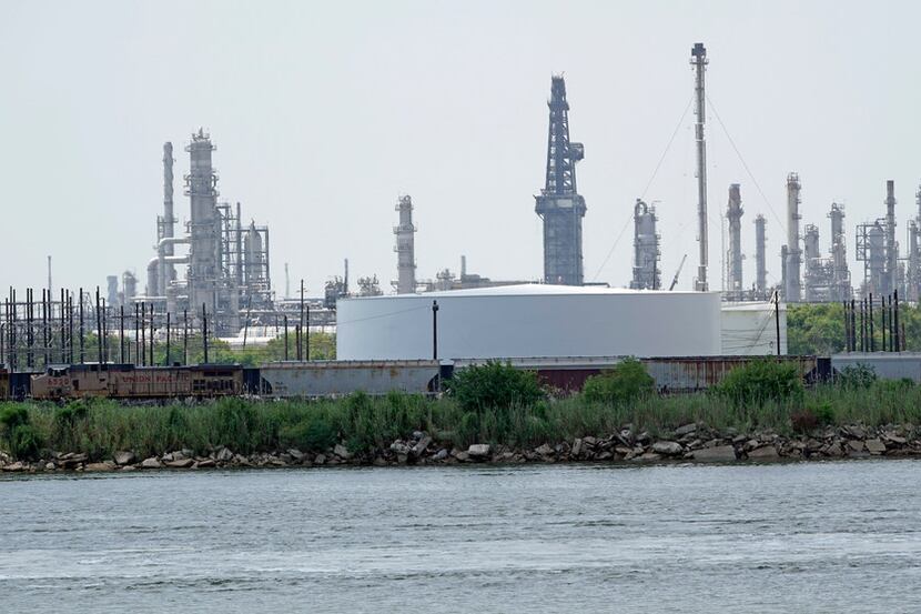 Storage tanks at a refinery along the waterway are shown Thursday, July 26, 2018, in Port...