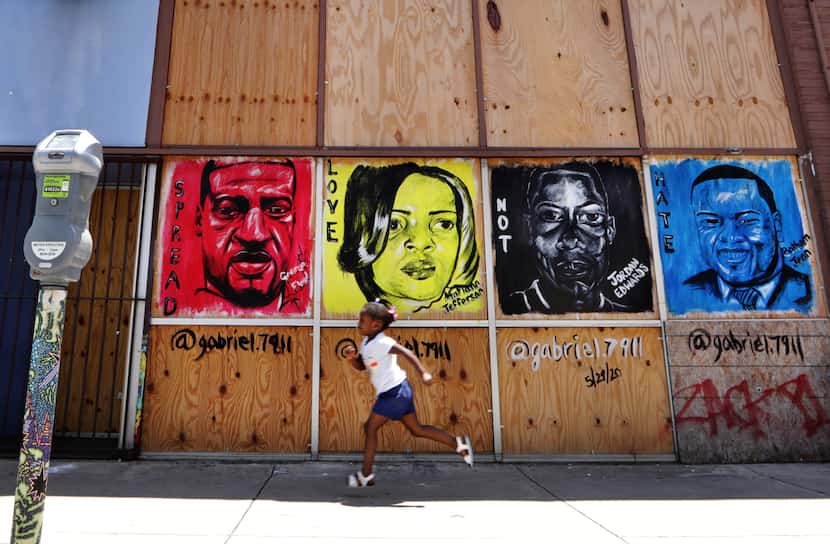 A mural painted in Deep Ellum days after George Floyd's death May 25 depicts, from left,...