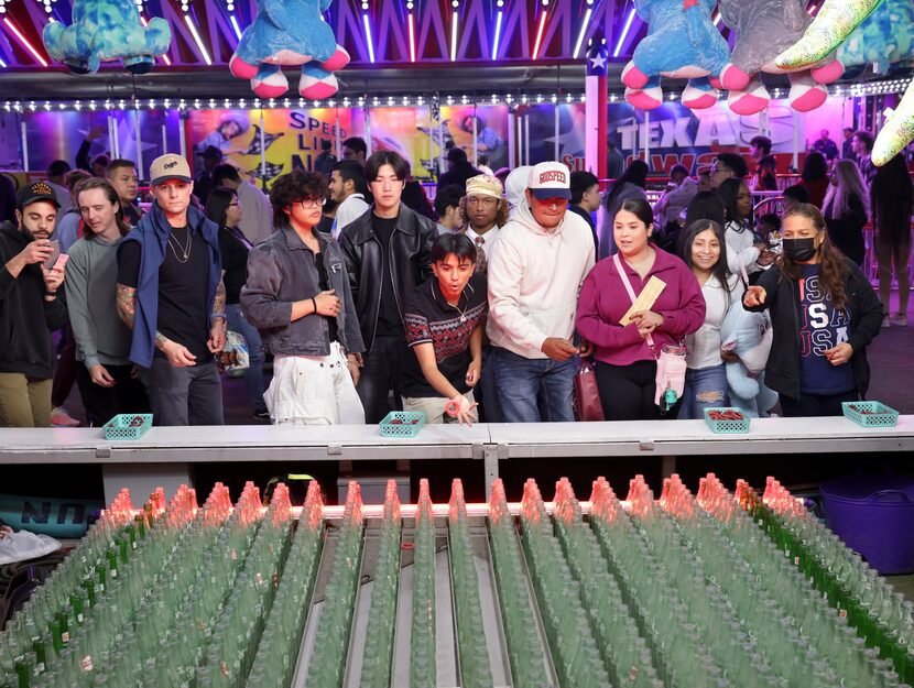 Fairgoers played a game at the State Fair of Texas in Dallas, on Oct 17, 2024.