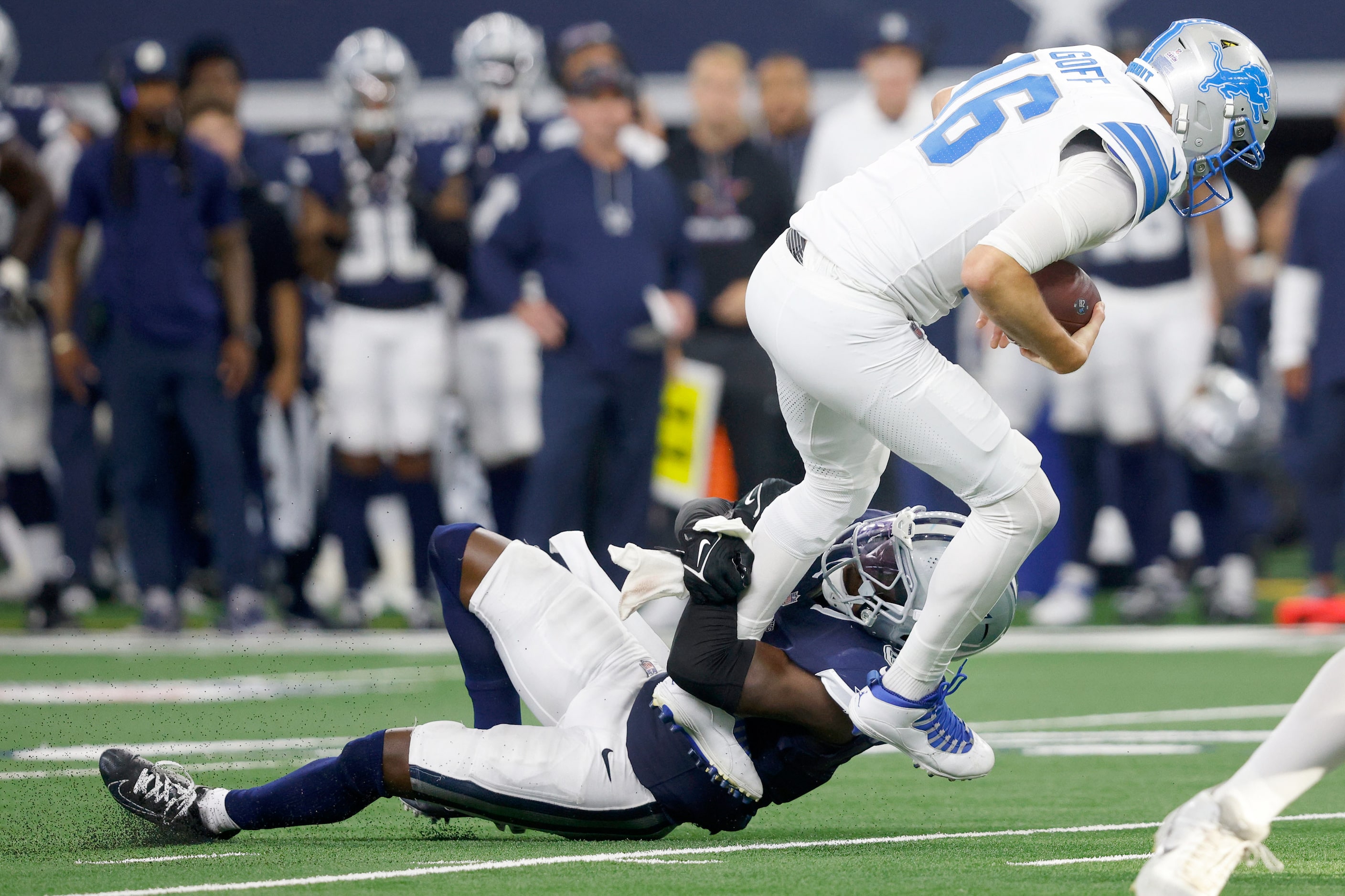 Detroit Lions quarterback Jared Goff (16) is tackled by Dallas Cowboys safety Donovan Wilson...