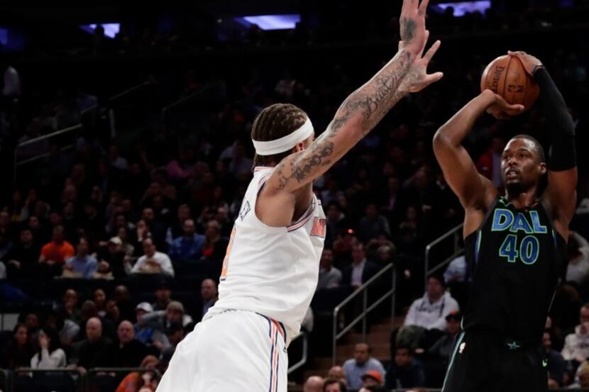 Dallas Mavericks' Harrison Barnes (40) shoots over New York Knicks' Michael Beasley during...