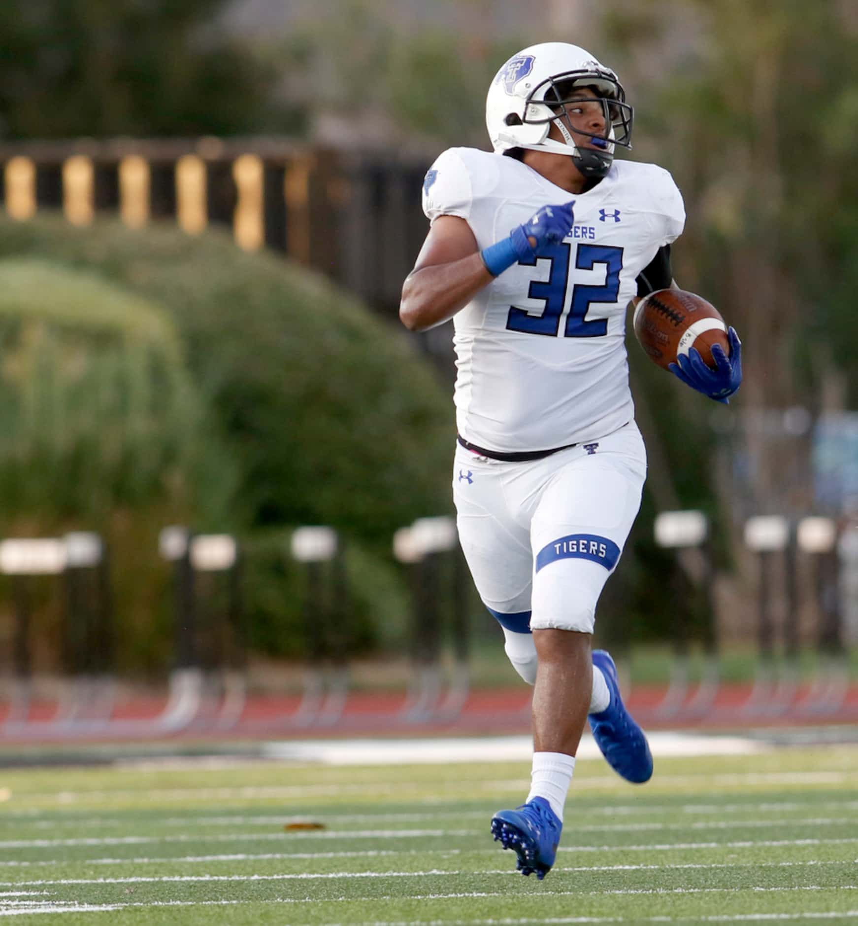 Trinity Christian-Cedar Hill special teams member Jeremiah McNeeley (32) looks over his...