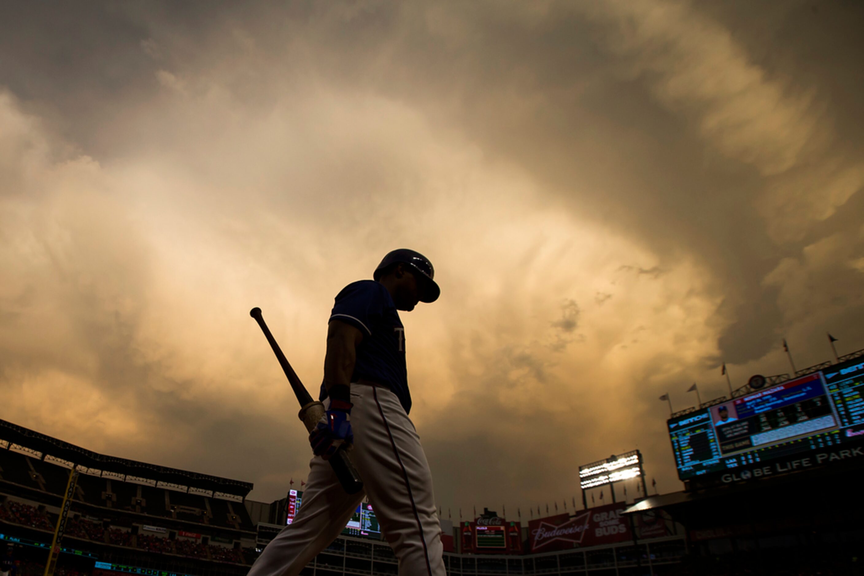 Texas Rangers third baseman Adrian Beltre walks back to the dugout from the on deck circle...