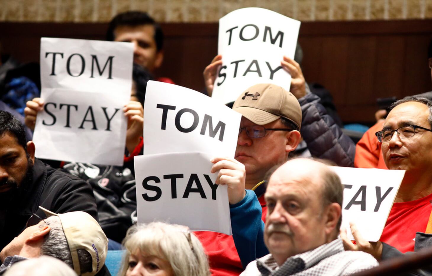 Supporters of Plano councilman Tom Harrison show their support during a specially called...