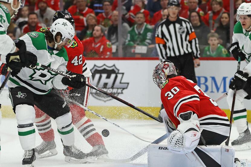 CHICAGO, ILLINOIS - FEBRUARY 24: Mats Zuccarello #36 of the Dallas Stars tries to get off a...