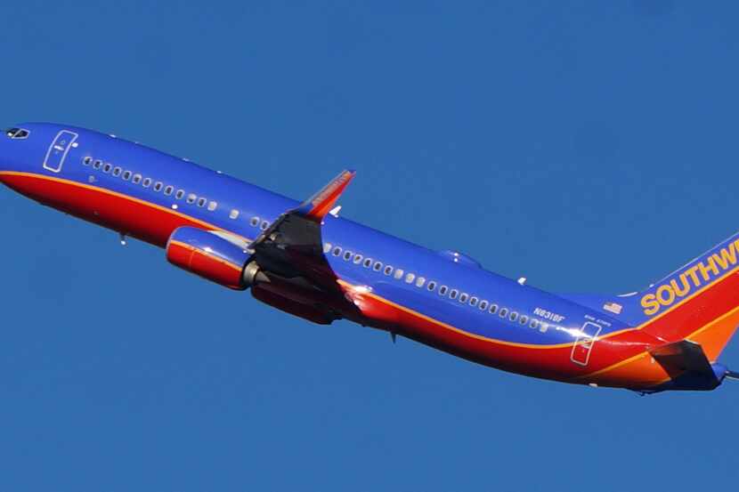  A Southwest Airlines' Boeing 737-800 jet takes off from Dallas Love Field.