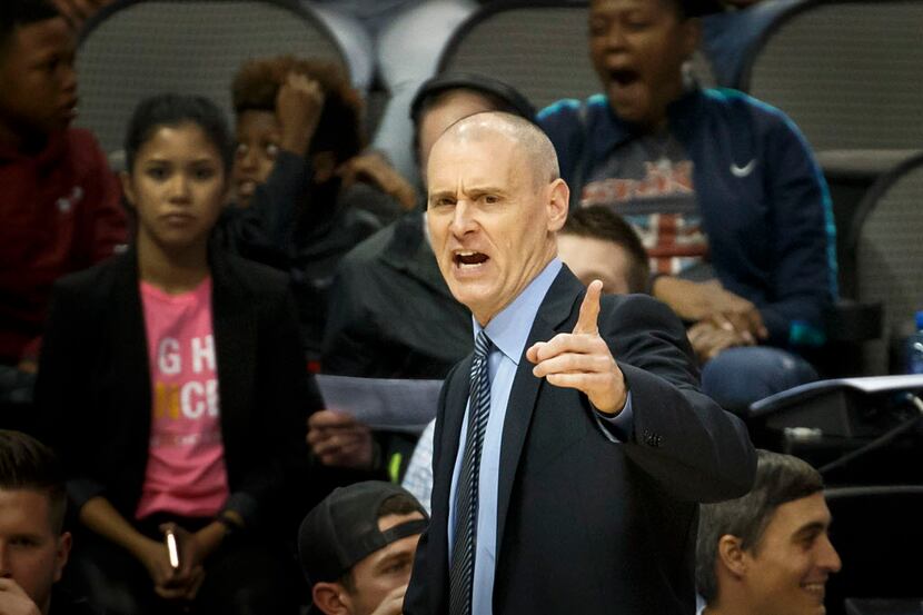 Dallas Mavericks head coach Rick Carlisle calls in a play during the second half of an NBA...
