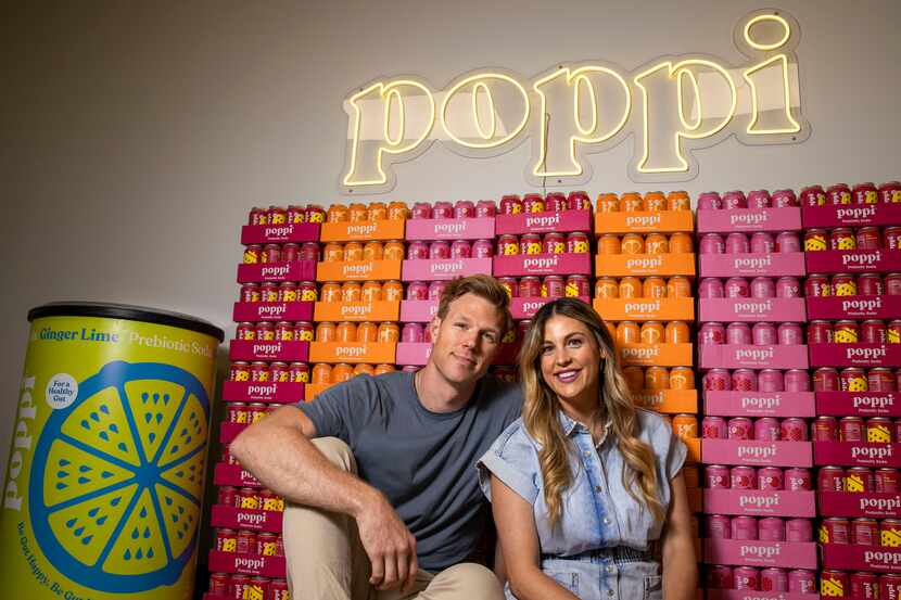 Husband and wife team Stephen and Allison Ellsworth pose for a portrait at the Poppi office...