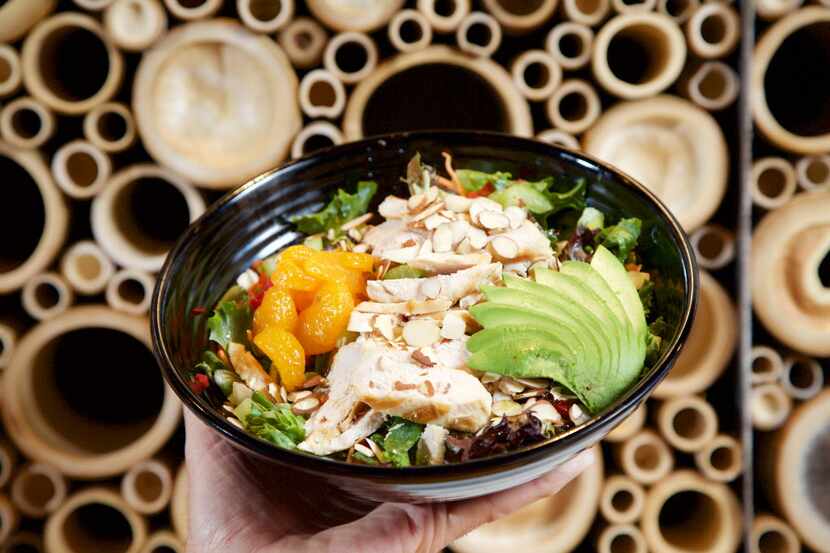 Nikko Salad made with white chicken, tofu, madrid oranges, mixed greens, red peppers,...