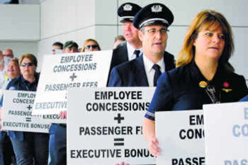  Transport Workers Union members were joined by pilots and flight attendants as they...