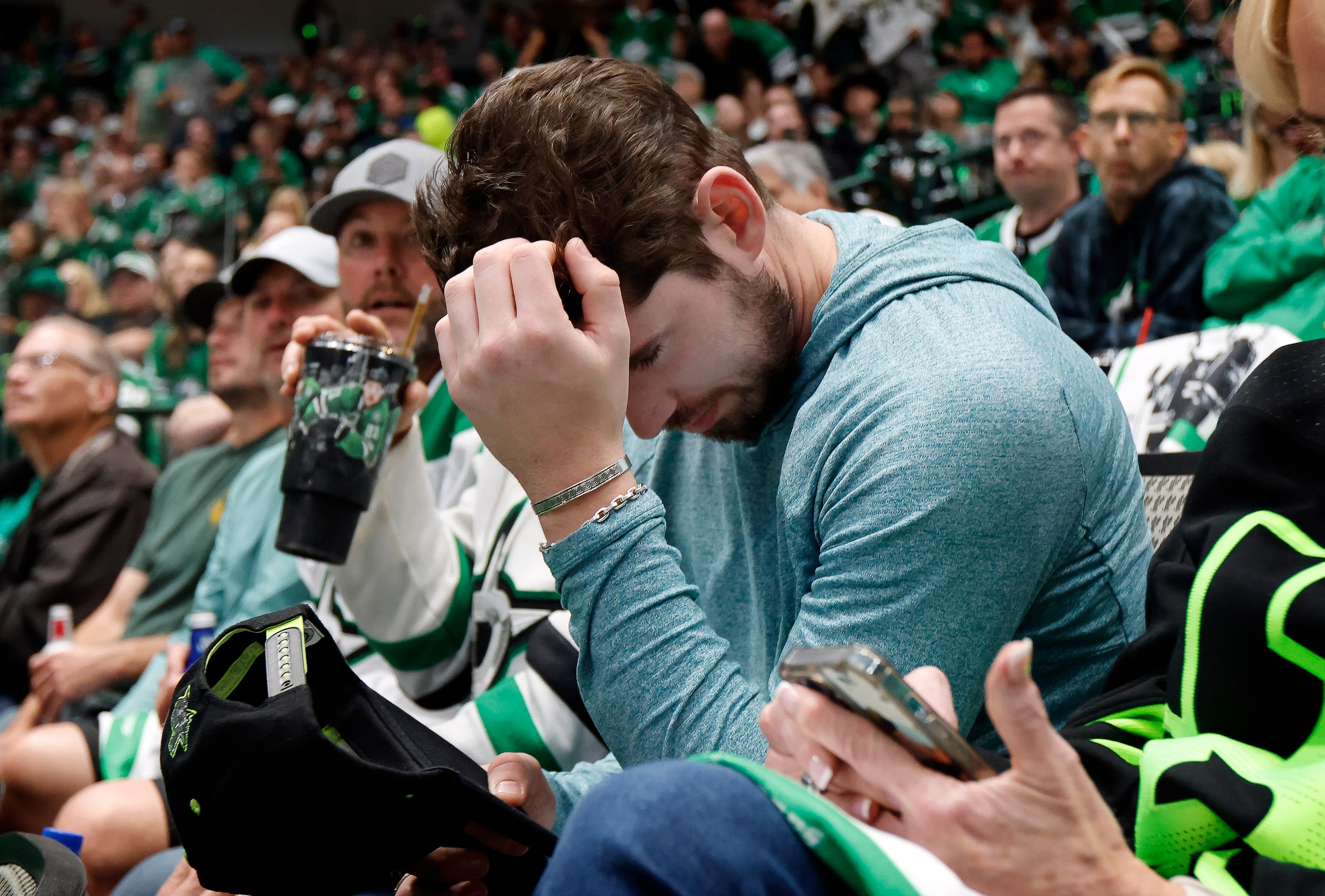 Dallas Stars fan Morgan Clark of Richardson reacts to the Vegas Golden Knights second goal...