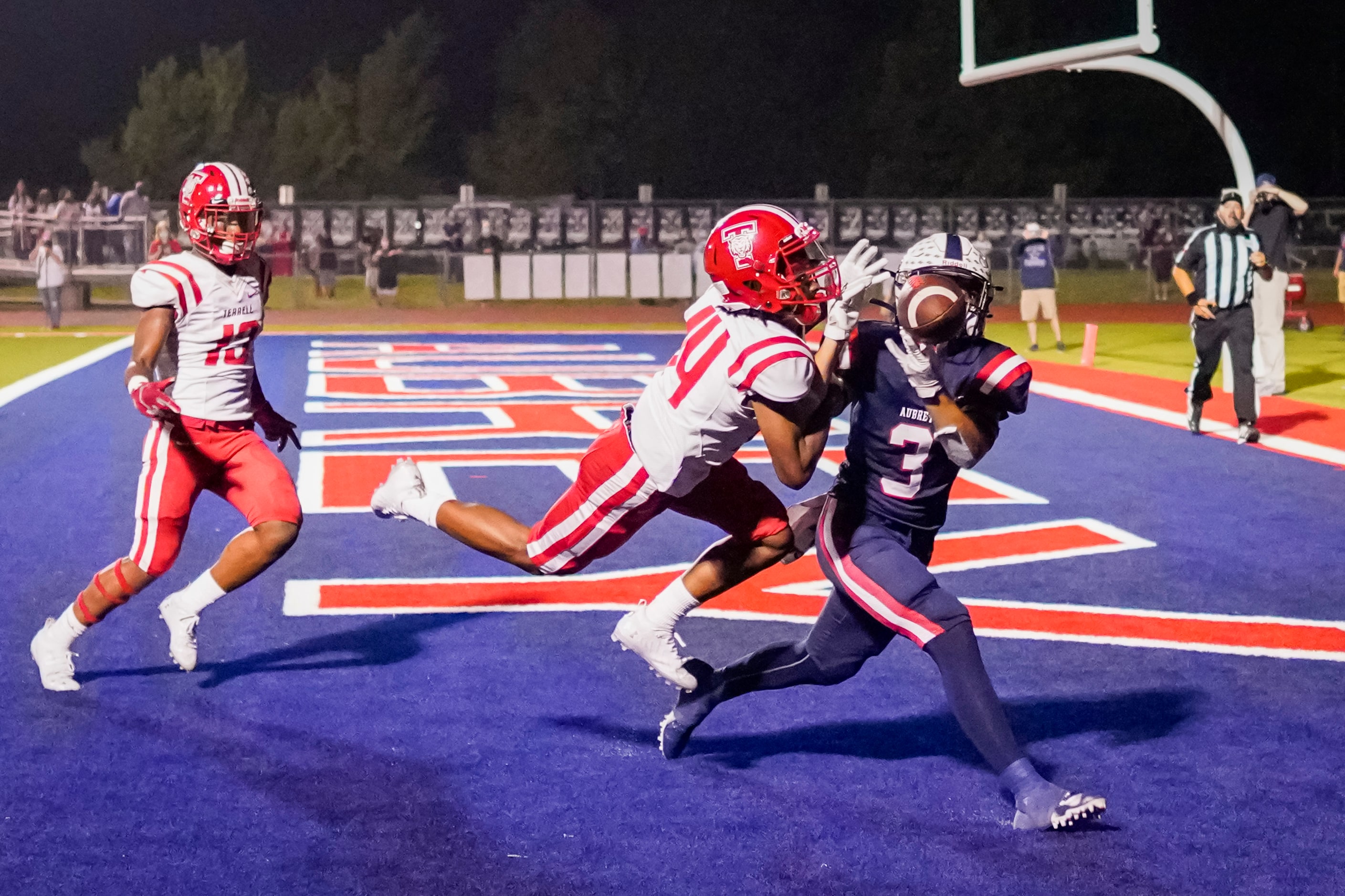 Terrell defensive back Gaylen Cobb (14) breaks up a pass intended for Aubrey’s Trenton...