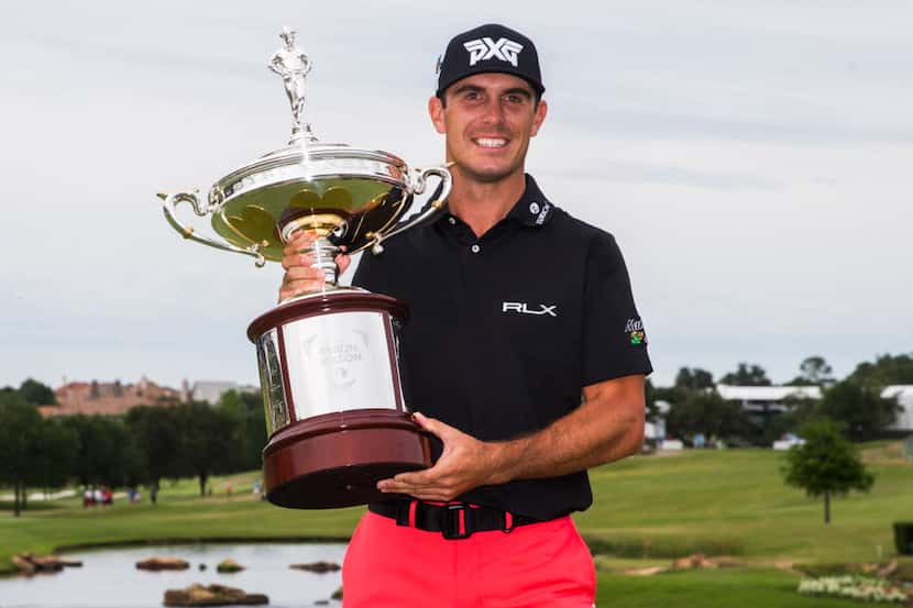Billy Horschel poses for a photo with his trophy after he won the tournament in a playoff in...