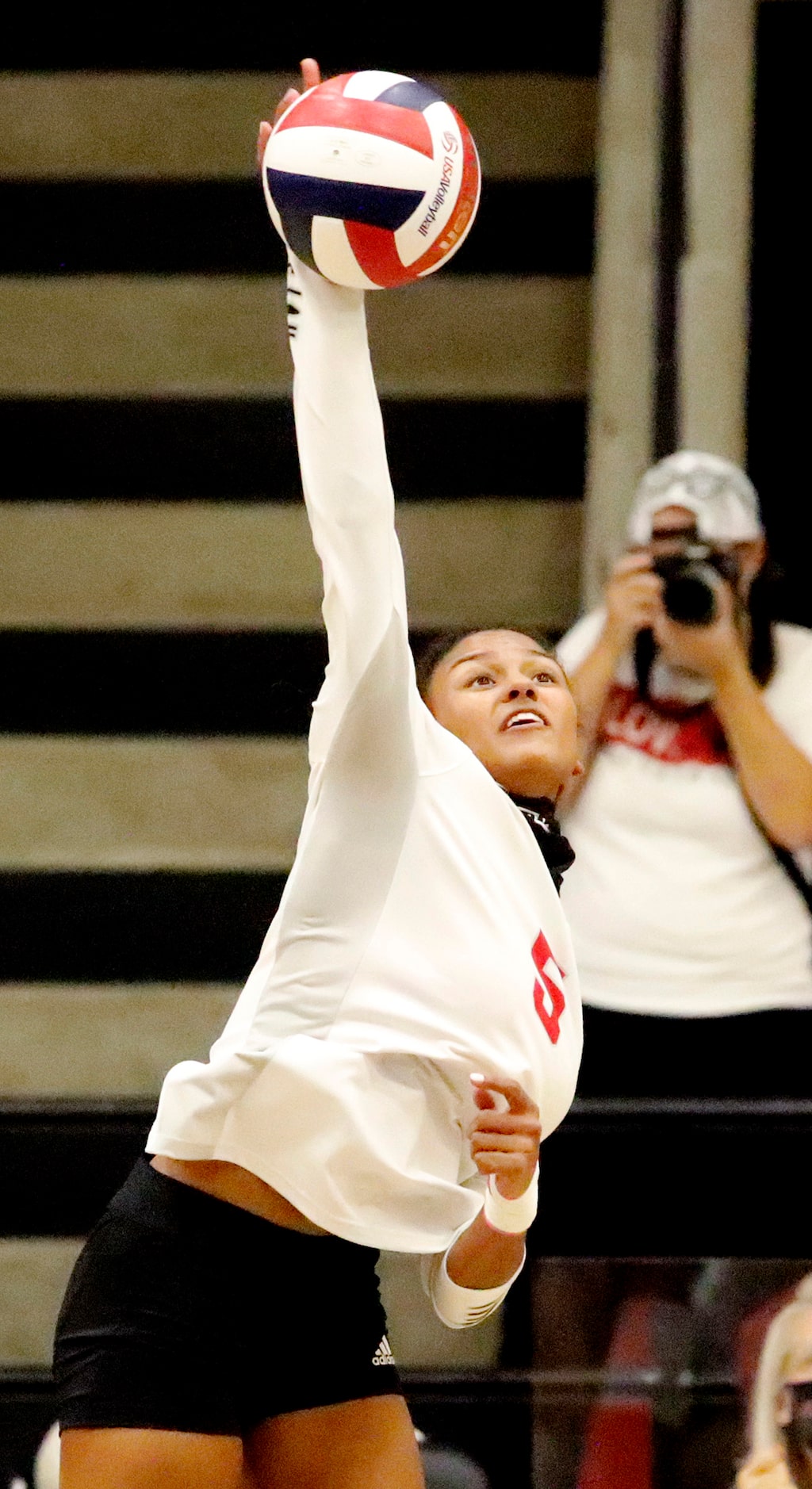 Lovejoy High School outside hitter Cecily Bramschreiber (5) makes a hit during game one as...