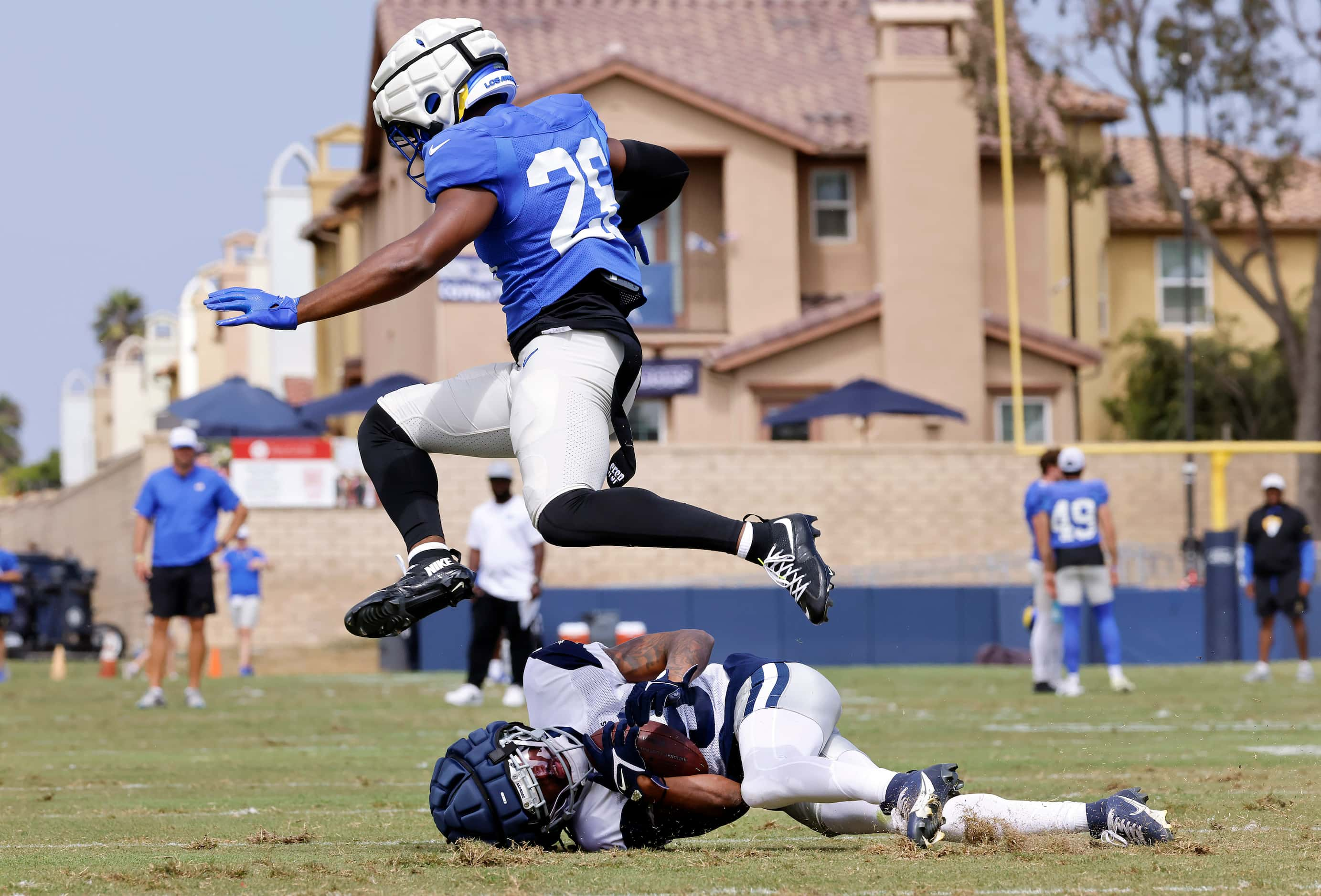 Los Angeles Rams safety Kamren Kinchens (26) leaps over Dallas Cowboys wide receiver...