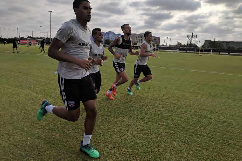 Reggie Cannon, Michael Barrios, Maxi Urruti, and Mauro Diaz (left to right) jog during FC...