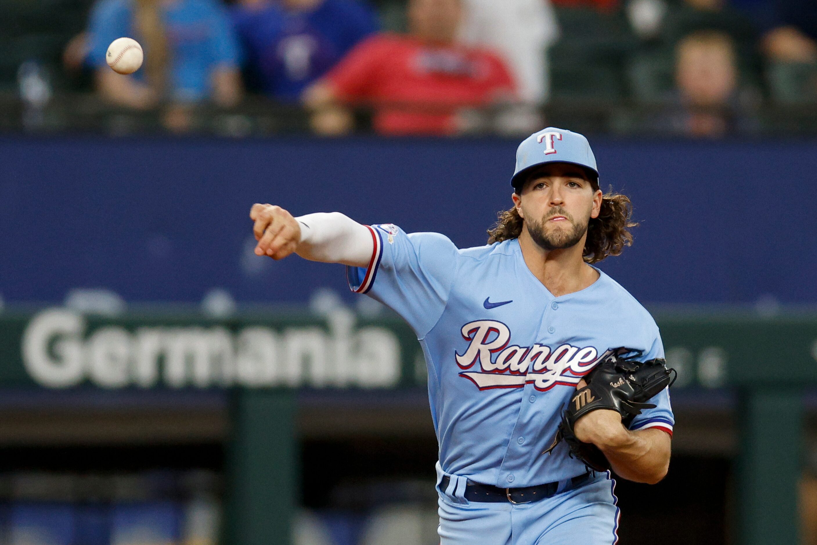 Texas Rangers third baseman Josh Smith (47) throws to first for an out during the ninth...