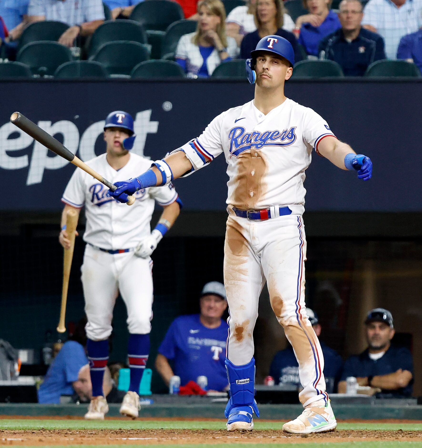 Texas Rangers batter Nathaniel Lowe reacts after striking out to Houston Astros relief...