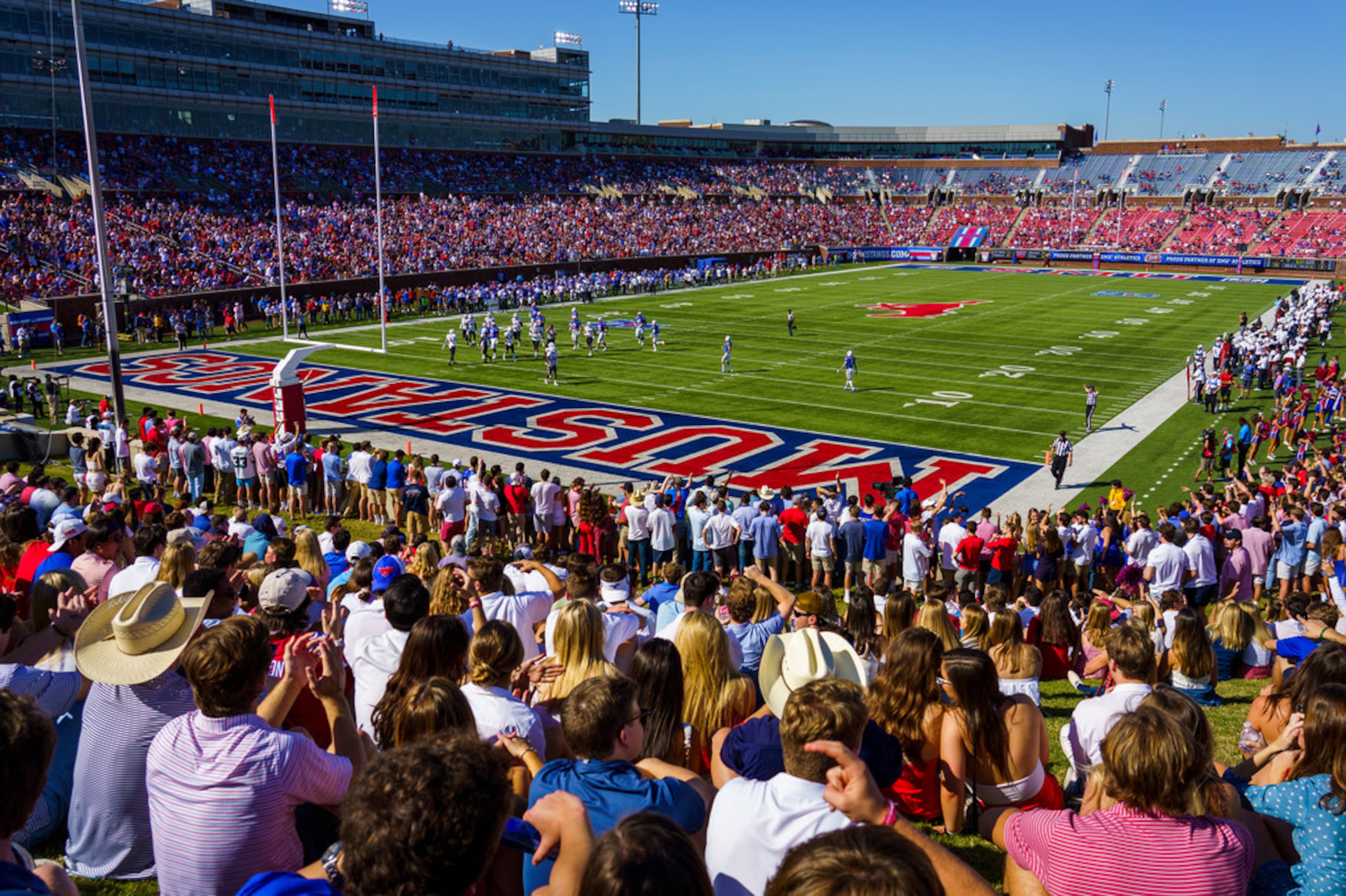 Fans watch during the first half of an NCAA football game between SMU and Temple at Ford...