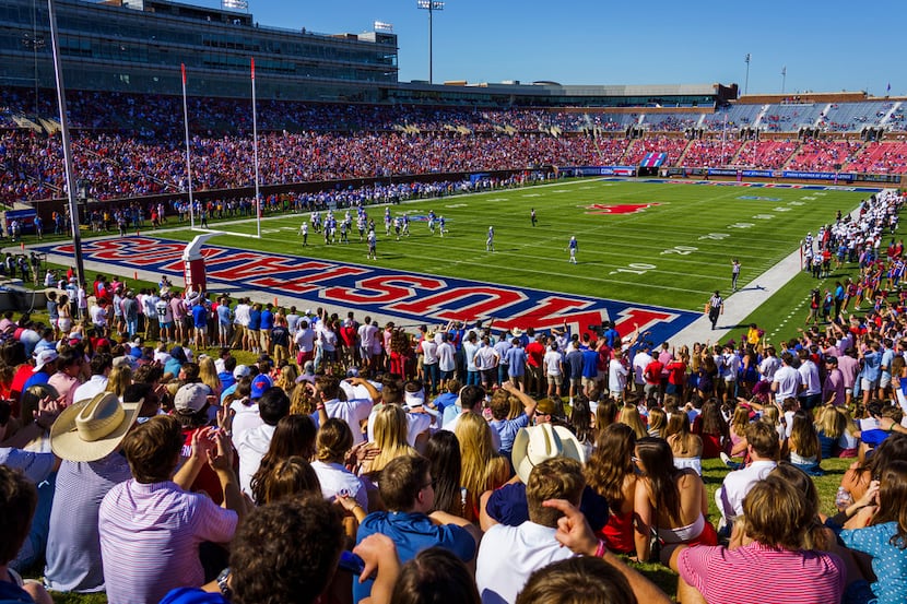 Fans watch during the first half of an NCAA football game between SMU and Temple at Ford...