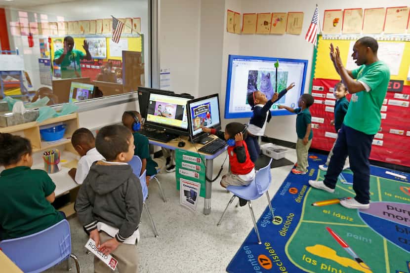 Teacher Traven Webb plays with his pre-kindergarten students in a classroom at N.W. Harllee...