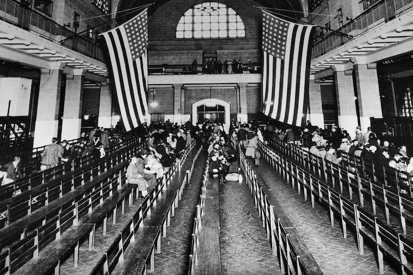 This 1924 file photo shows the registry room at Ellis Island in New York harbor, a gateway...