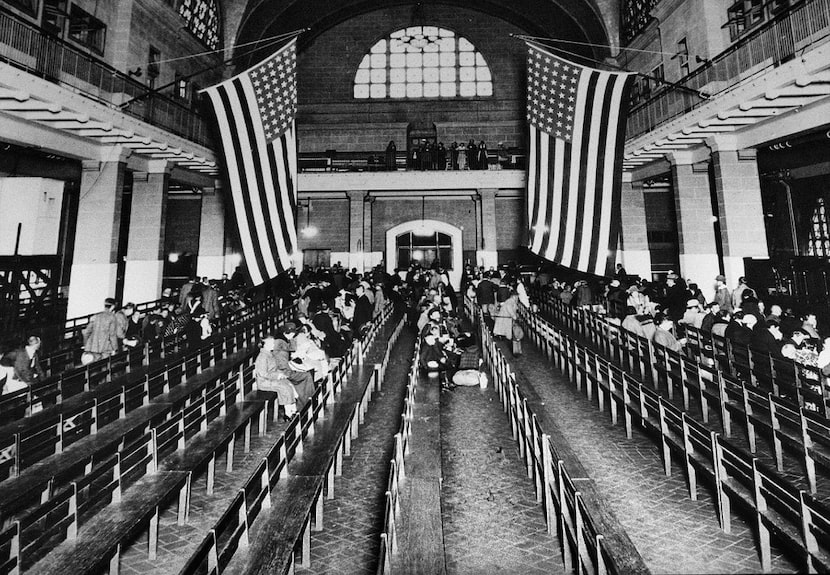 This 1924 file photo shows the registry room at Ellis Island in New York harbor, a gateway...