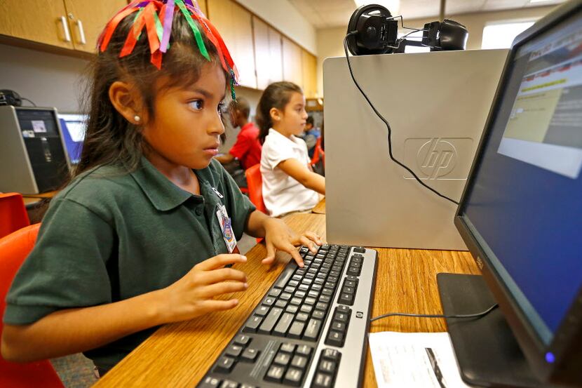 Leslie Vasquez Martinez, a  third-grader at T.J. Lee Elementary School in Irving works at a...