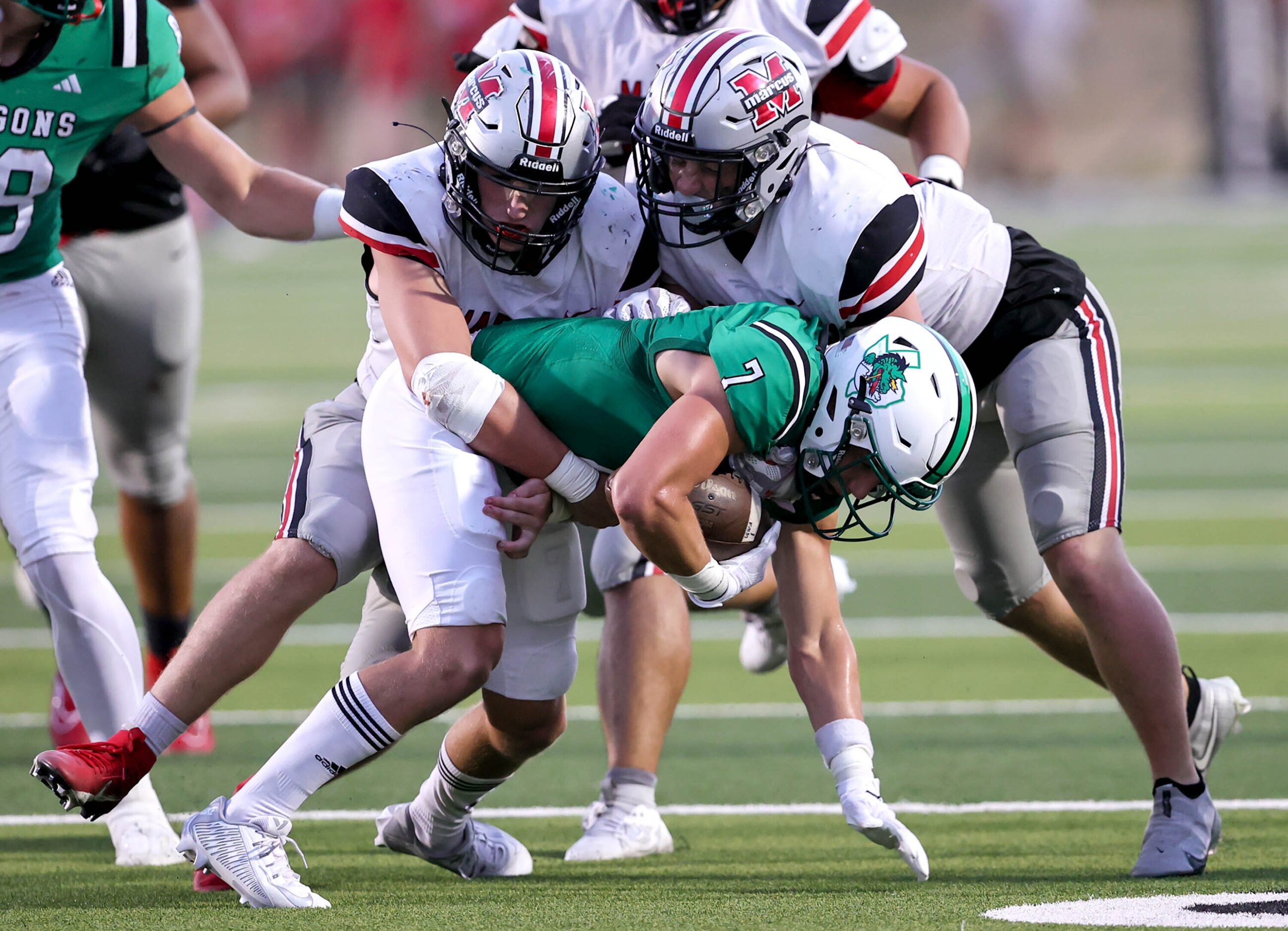 Southlake Carroll wide receiver Jacob Jordan (7) makes a reception and is immediately stop...