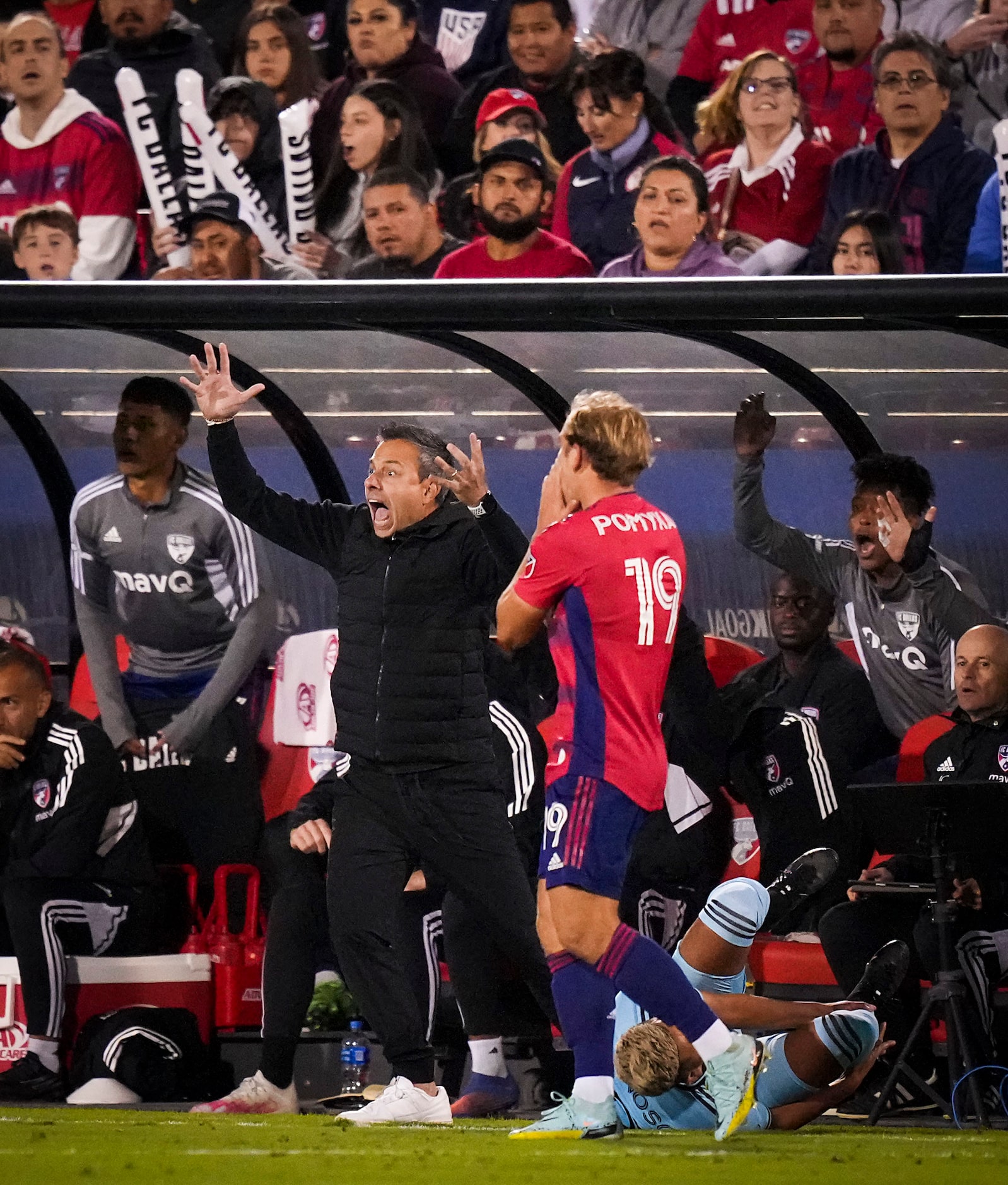 FC Dallas coach Nico Estévez reacts to a call during the first half of an MLS playoff soccer...