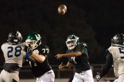 Arlington quarterback D'Montae Davis (7) passes during a high school football matchup...