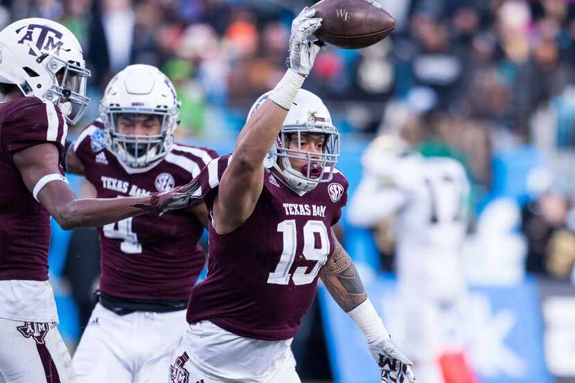 December 29, 2017: Texas A&M linebacker Anthony Hines III (19) celebrates after recovering...