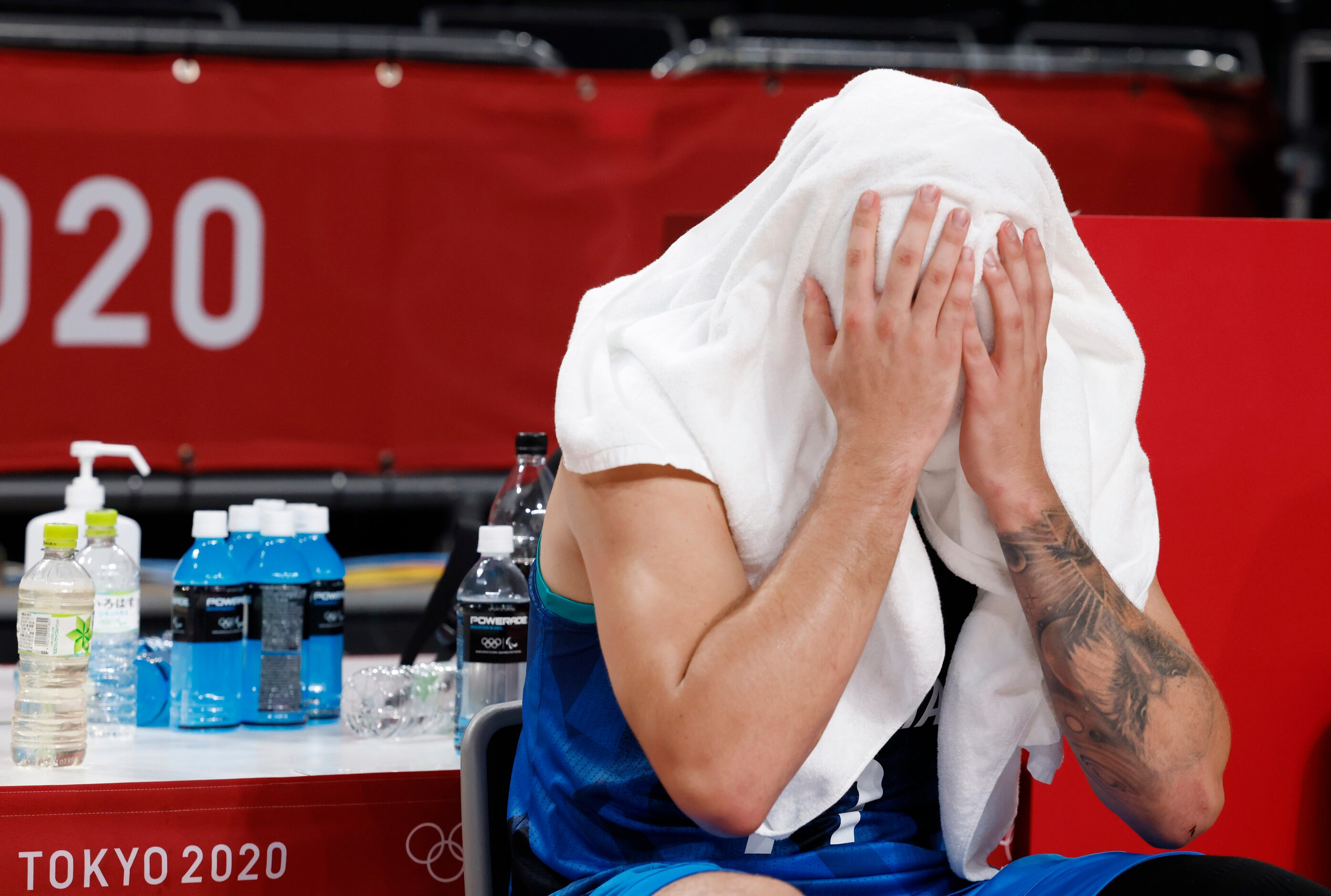 Slovenia’s Luka Doncic (77) sits dejected after losing to France 90-89 in a men’s basketball...