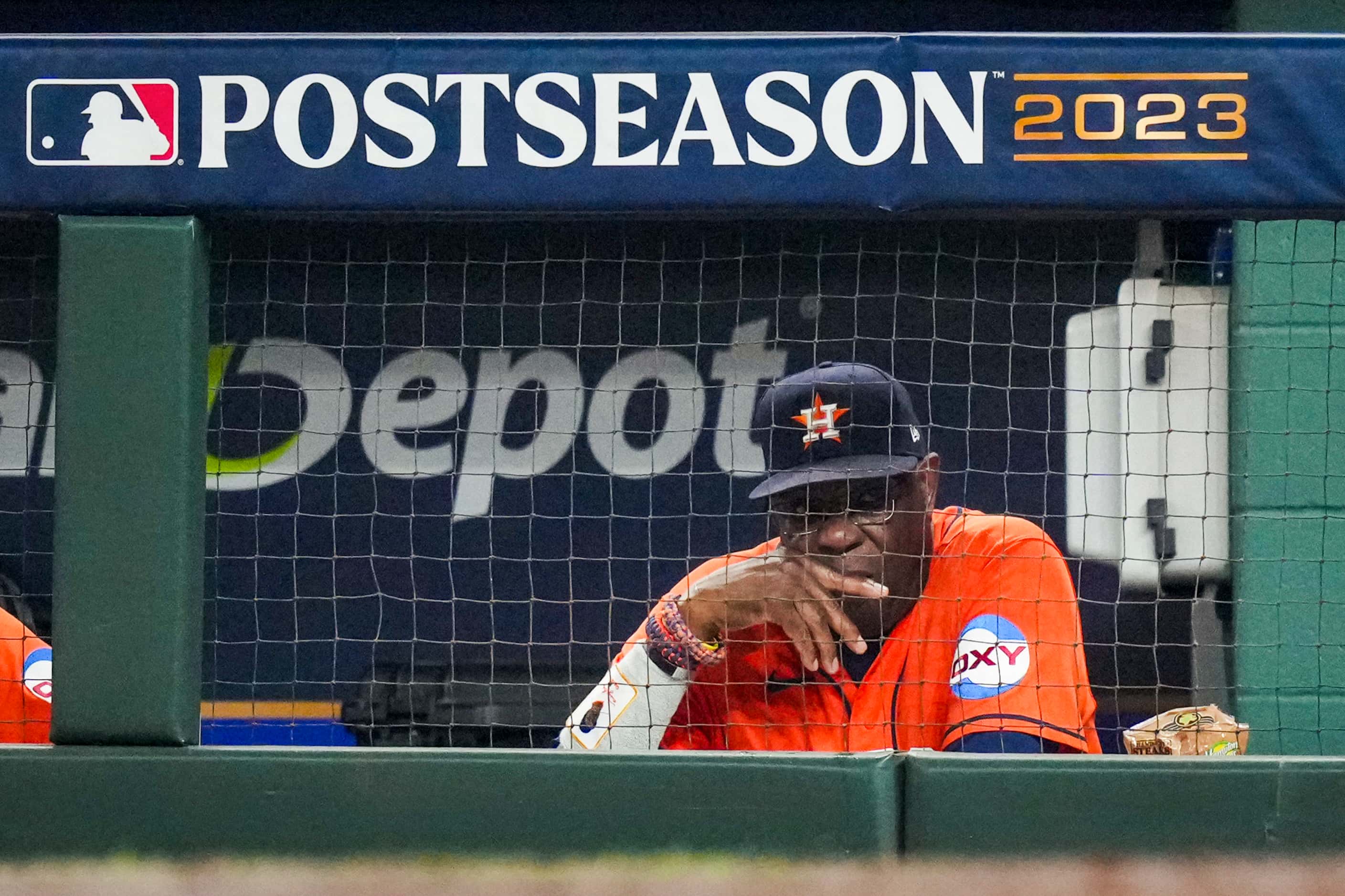 Houston Astros manager Dusty Baker looks out from the dugout after a home run by Texas...