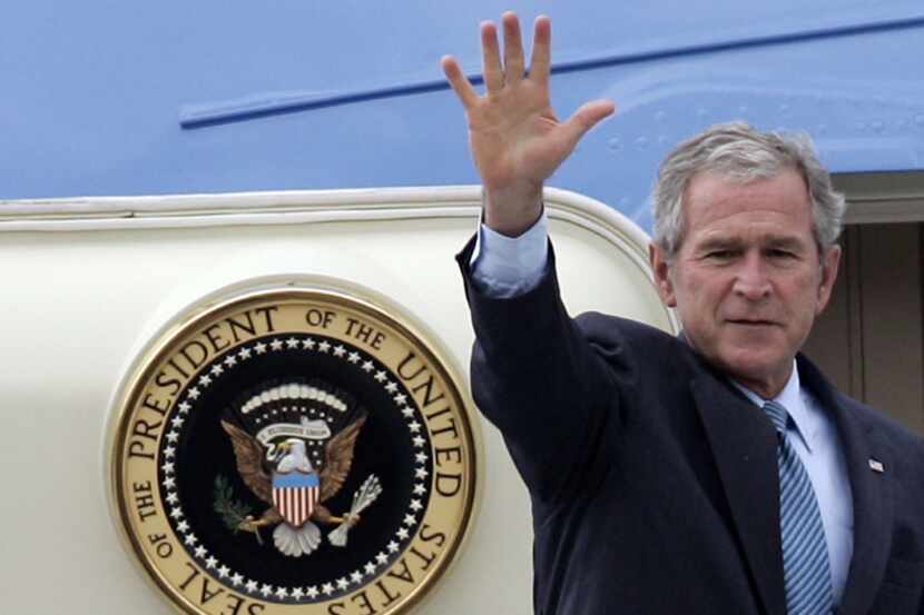 
George W. Bush waves to photographers during his last presidential trip to Europe in June...